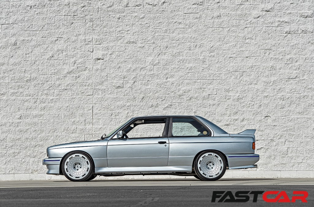 side profile shot of silver Modified BMW M3 E30