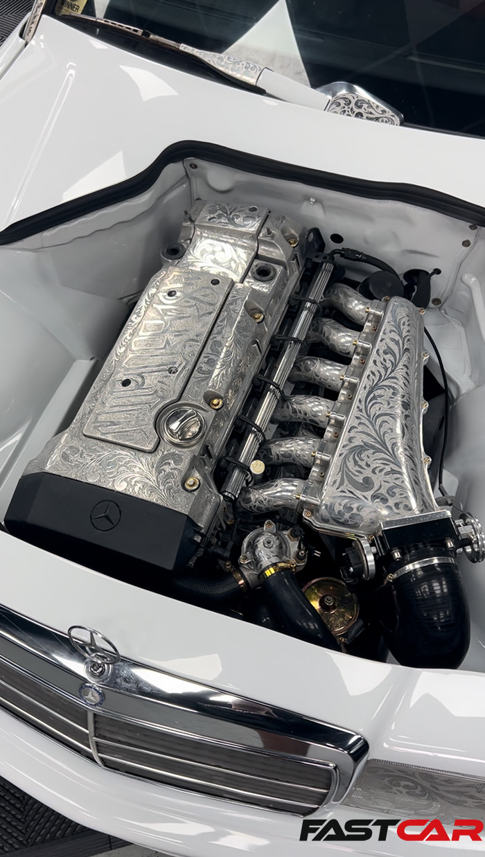 engraved engine in modified mercedes 190e 