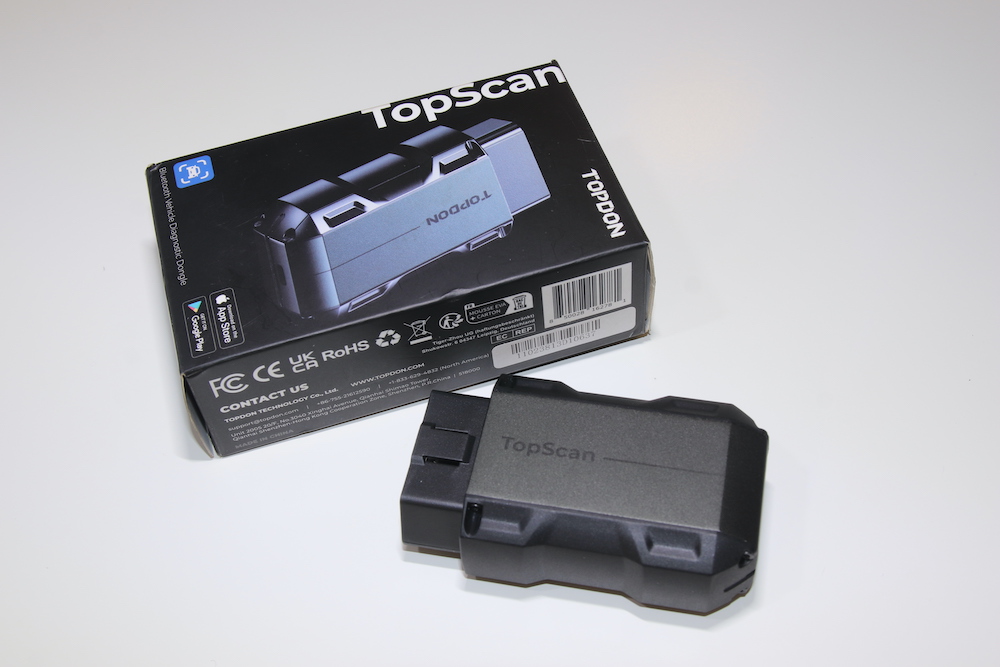 TopScan OBD dongle beside its packaging