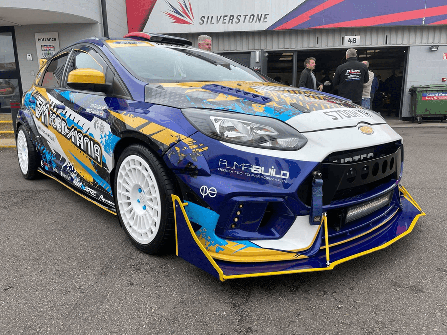 heavily modified Focus ST at a car show