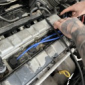 Installing new blue ignition leads to an engine