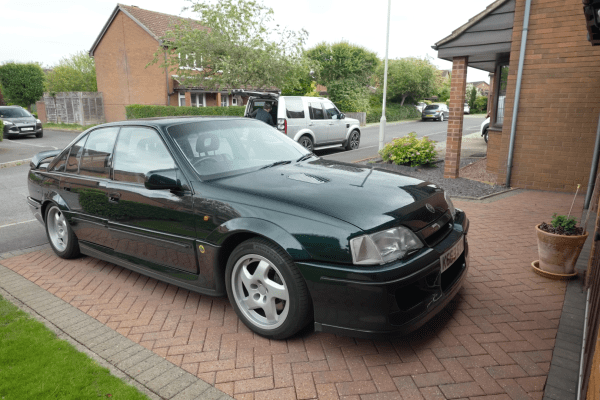Lotus Carlton parked on a driveway on residential estate