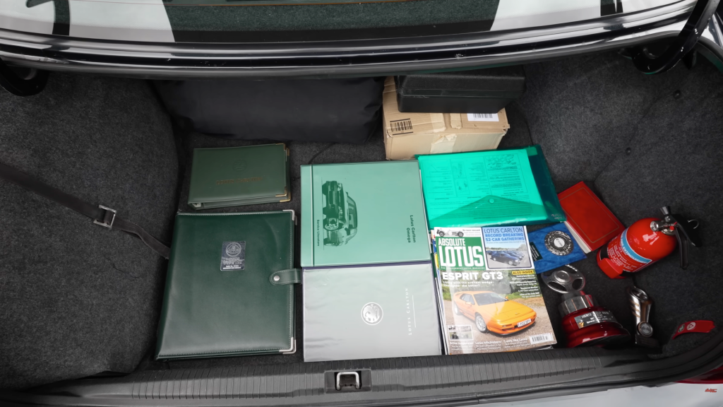The boot of this Lotus Carlton is full of service history and owner documents belonging to the car