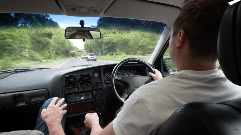 looking over the left shoulder of Auto Alex as he test drives a Lotus Carlton