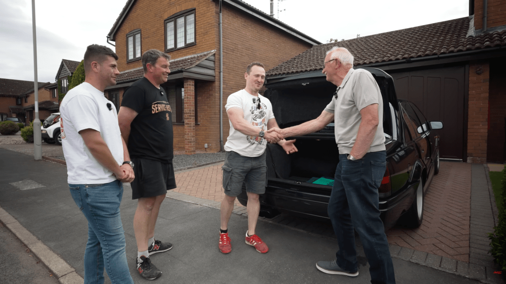 Auto Alex shaking hands with owner as he successfull completes deal to purchase Lotus Carlton
