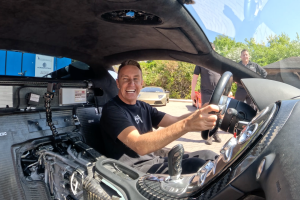 Mark McCann smiling after taking his rebuilt Bugatti Veyron for a first test drive