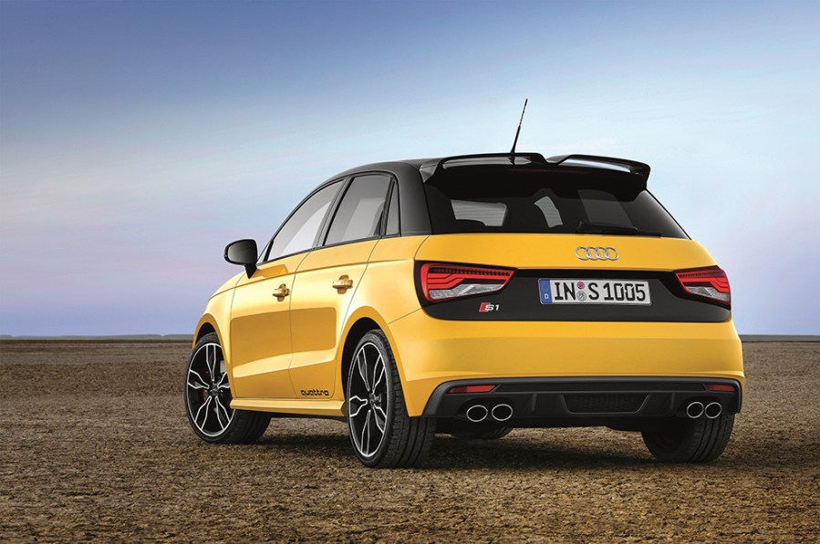 Back left shot of yellow Audi S1 with a desert background