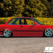 red BMW E30 side-profile