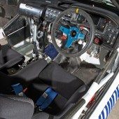 A view into the driver's seat of a blue and white Escort Cosworth WRC