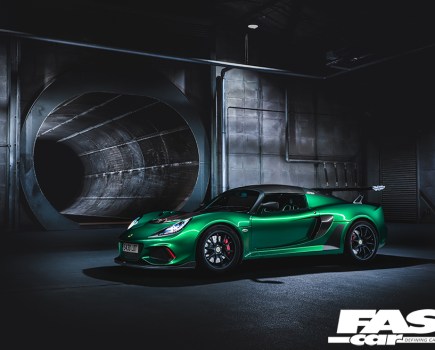 A front left side view of a bright green Lotus Exige Cup 430