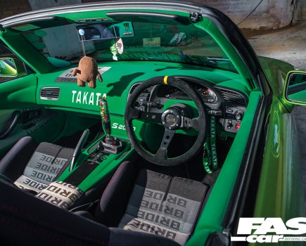 The modified interior of a bright green Honda S2000