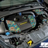 A colourful Mountune engine inside a blue Ford Fiesta