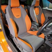 The orange and grey interior of an orange Ford Focus ST Mk2