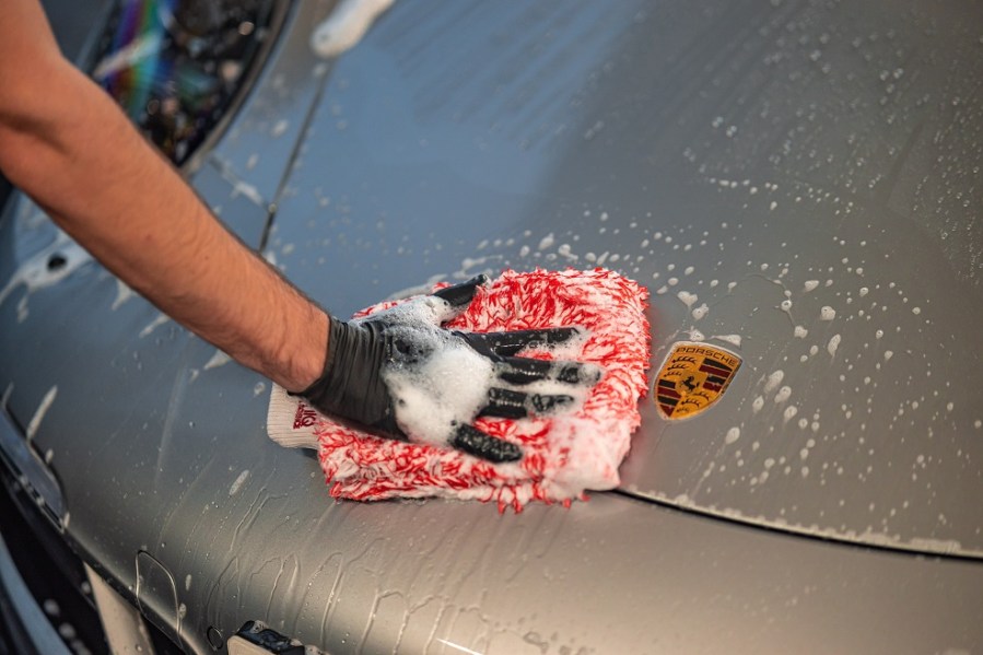 detailed shot of cleaning a Porsche