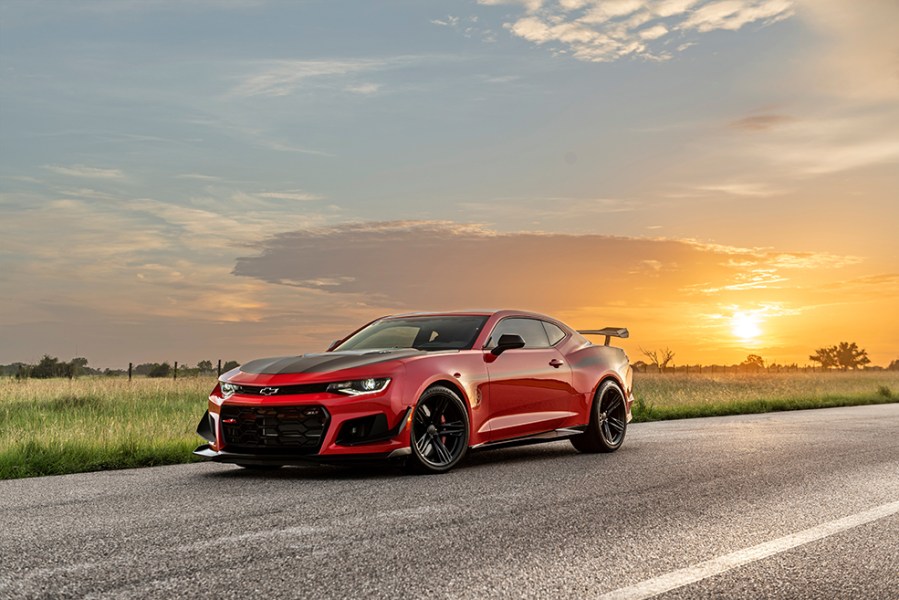 A front left side shot of a black and red Hennessey Exorcist Camaro ZL driving