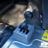 A close up shot of the gear stick inside a Lamborghini Miura