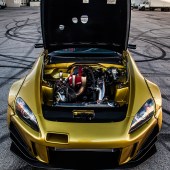 Front view under the bonet of a gold Turbo S2000: Miami Rice