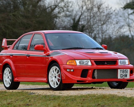 A shot of the front right side of a red Mitsubishi Evo VI