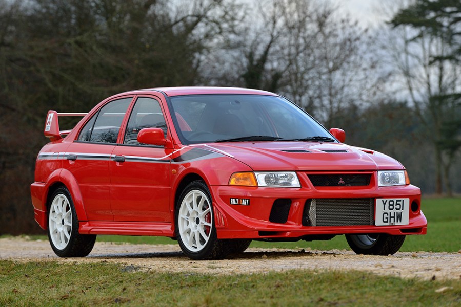 A shot of the front right side of a red Mitsubishi Evo VI