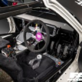 A view of the black interior of a Mazda MX 5 drift car