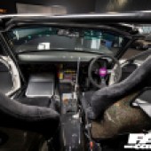 A view forwards between the two seats inside a Mazda MX 5 drift car