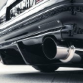 The exhaust tips of a modified Mazda RX-7 FC