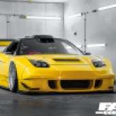 front of tuned yellow NSX