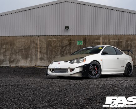 A front left side shot of a white Honda Integra Type R with black features