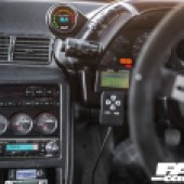 A close up of the dash dials in a grey modified Nissan Skyline R32 GT R