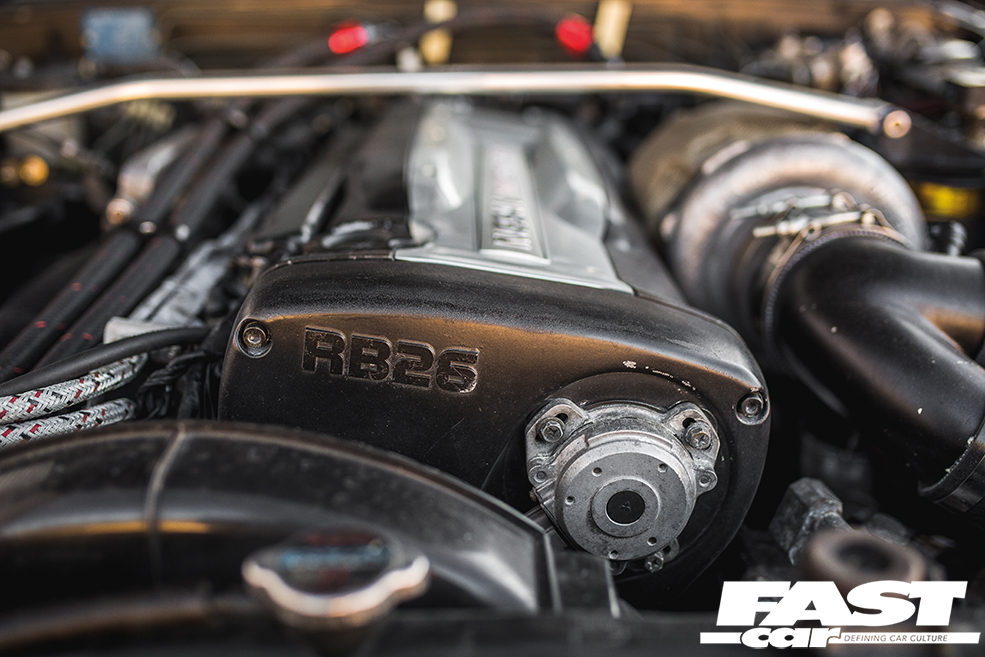 A close up of a RB26DETT engine in a modified Nissan Skyline R32 GT R