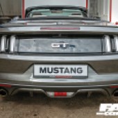 A close rear central shot of a grey Mustang GT4