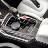 The gear stick and middle controls of a BMW M3