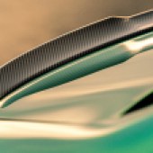 A close up of carbon detailing on a green BMW M3