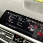 A close up of the wide digital screen in a BMW M3
