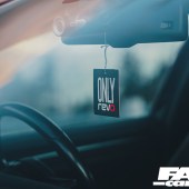 A focused shot of a Revo air freshener on the rear view mirror of a Revo VW Golf R