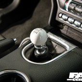 A gear stick close up shot inside a Supercharged Mustang Steeda
