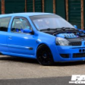 The right side of a blue Renault Clio 182 with no bonnet