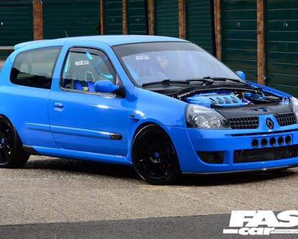 The right side of a blue Renault Clio 182 with no bonnet
