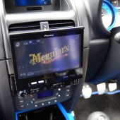 A close up of a digital screen inside a blue Renault Clio Sport 182