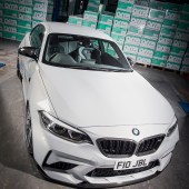 A high front right shot of a white BMW M2