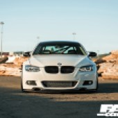 A front central view of a white tuned BMW E92 335i