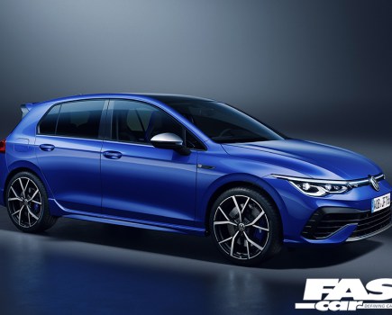 A right side shot of a royal blue VW Golf R Mk8