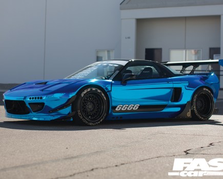 The left side of a blue mirrored Japanese NSX